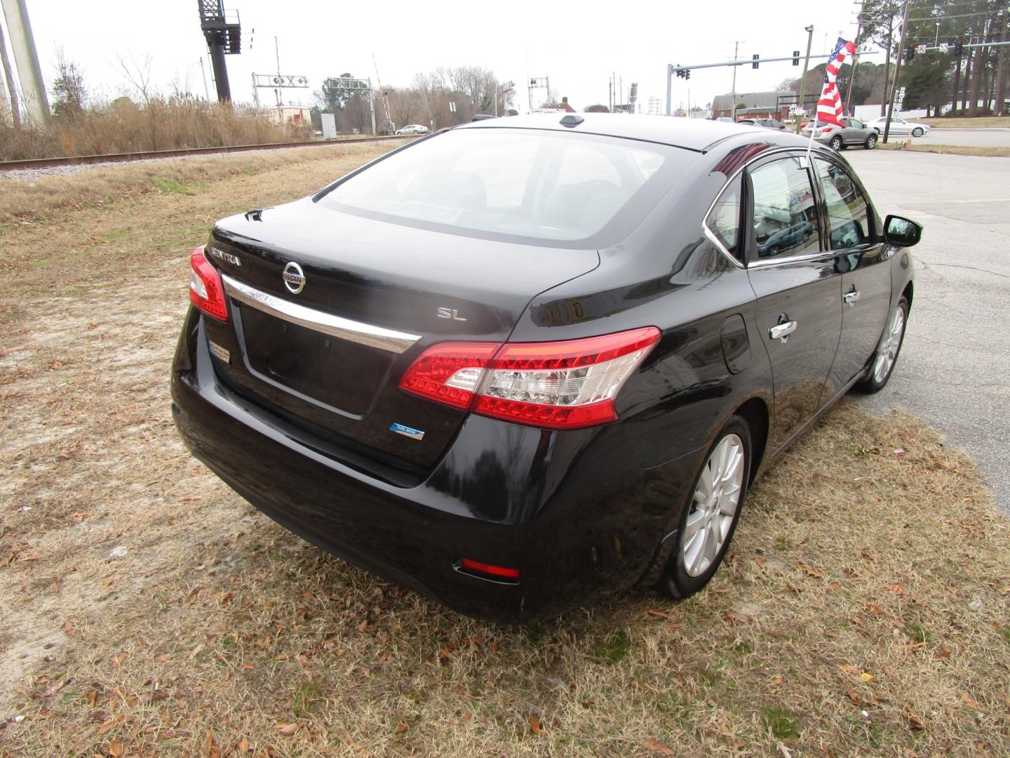 2014 Black Nissan Sentra S 6MT (3N1AB7AP6EY) with an 1.8L L4 SFI DOHC 16V engine, 6-Speed Automatic transmission, located at 2553 Airline Blvd, Portsmouth, VA, 23701, (757) 488-8331, 36.813889, -76.357597 - Photo#5